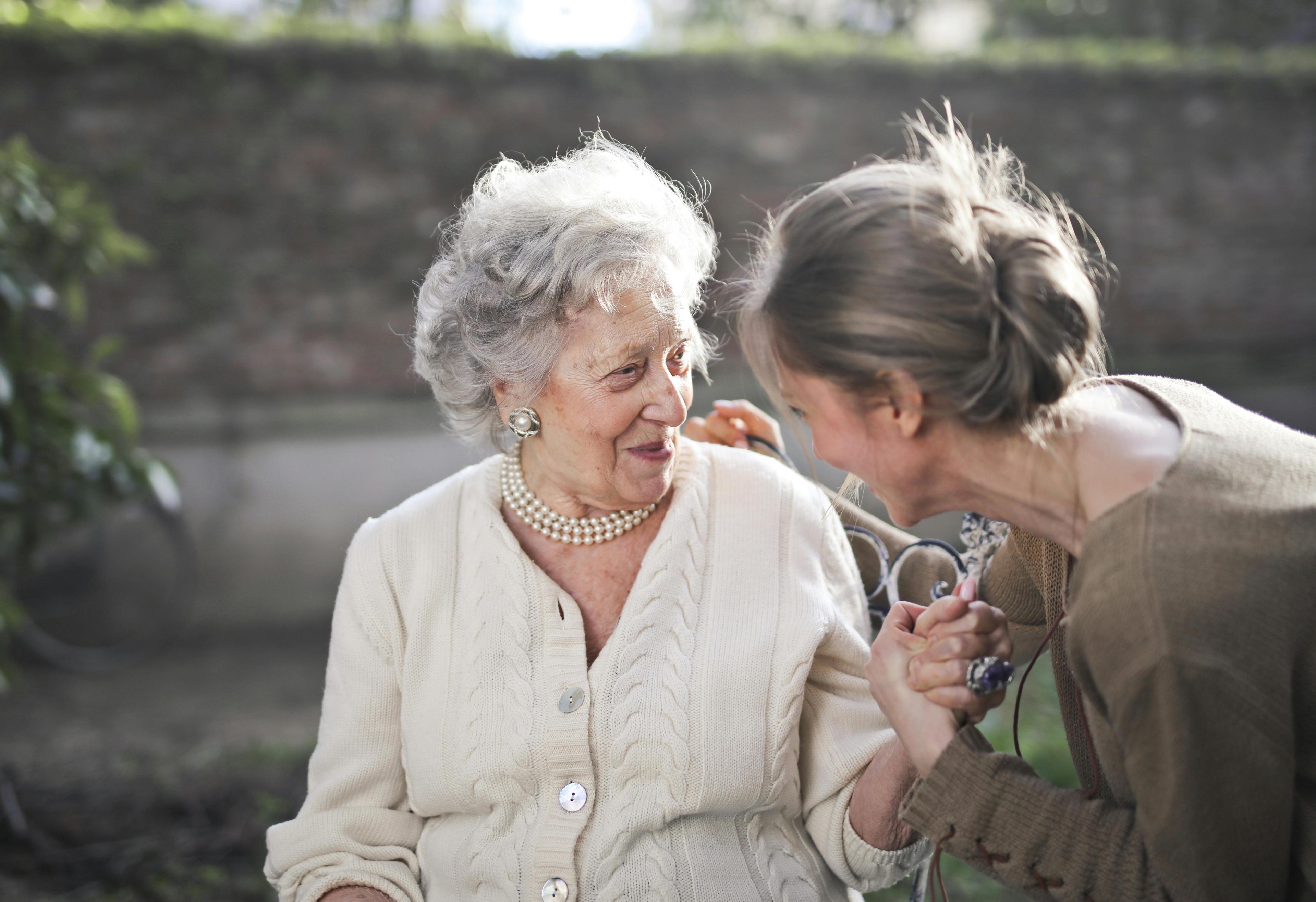 Care worker smiling with client in London
