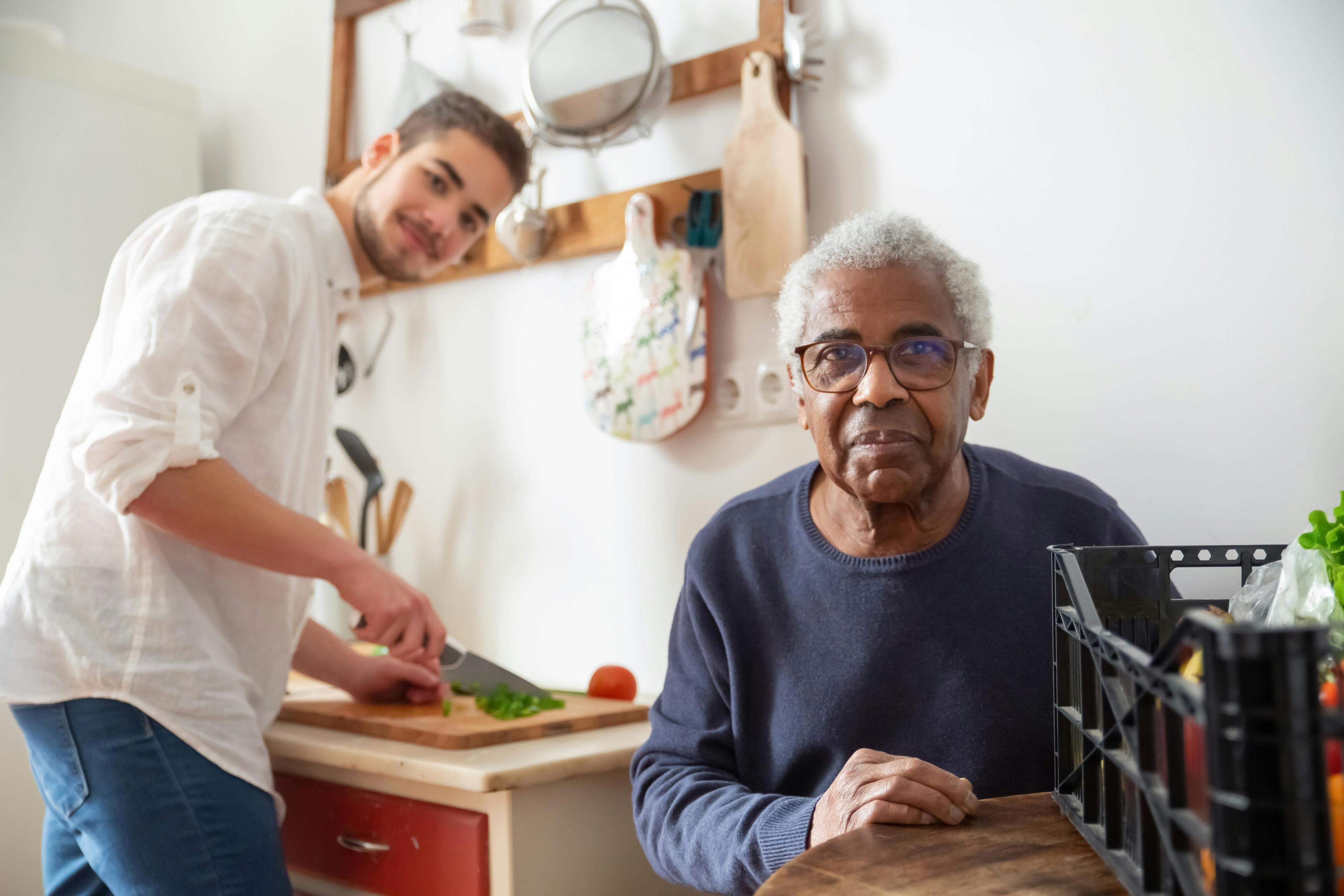 Carer supporting an older client at home